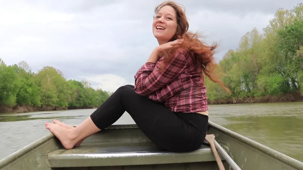 Hook Line and Chill host smiling aboard a small fishing boat