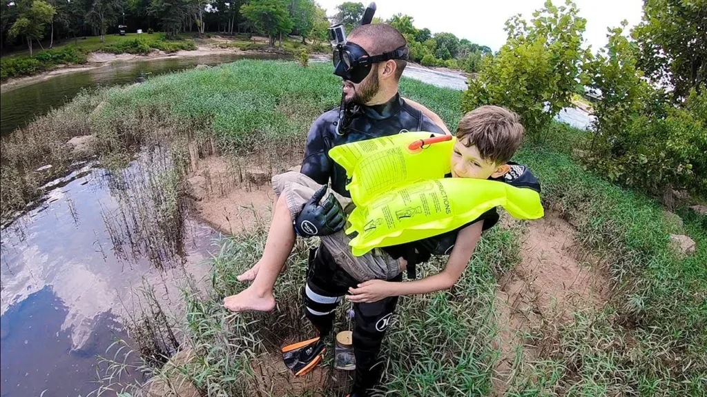 Jiggin With Jordan preparing diving equipment beside the water