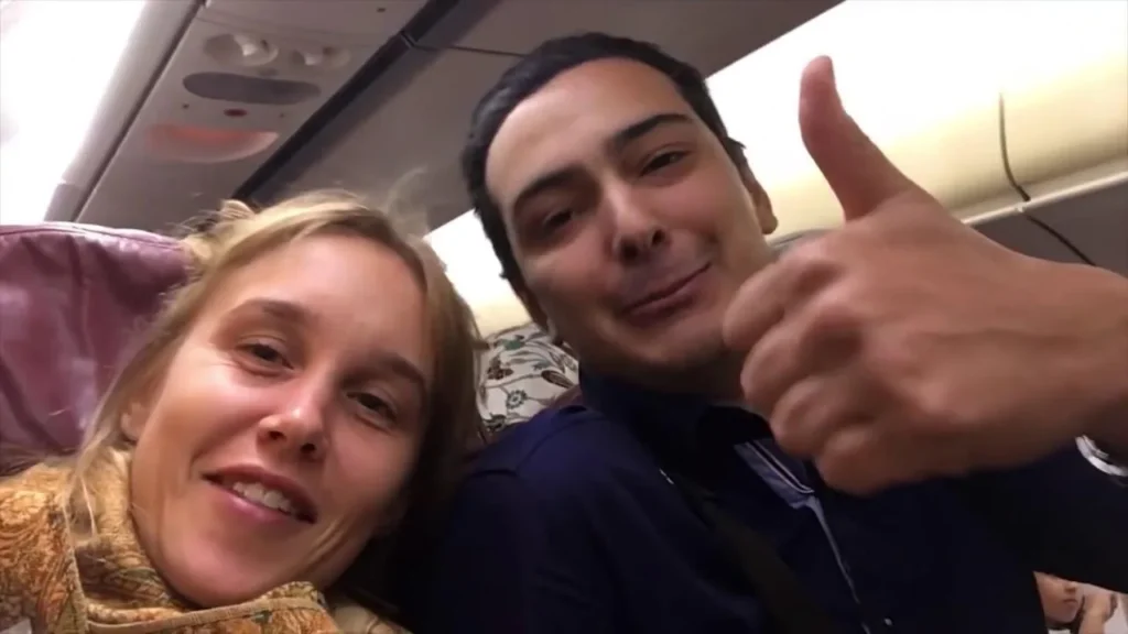 Josje Leyten and her travel companion smiling in transit