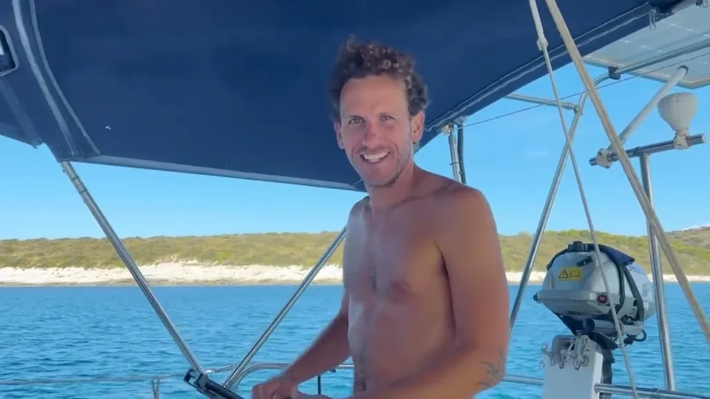 Leading the Escapade crew member smiling aboard a sailboat in Croatia
