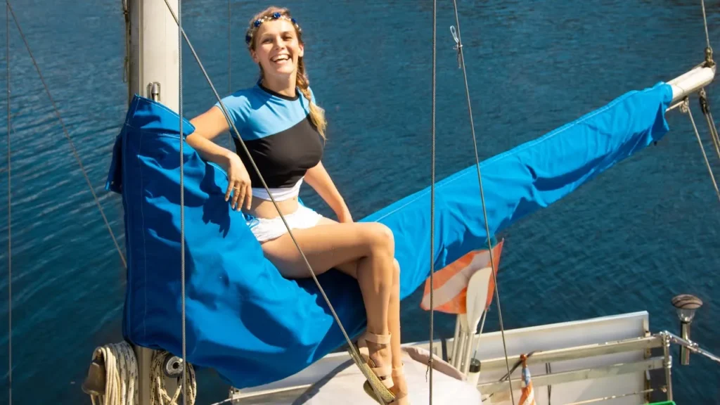 Helen of Sailing Liberty sitting aboard a sailboat