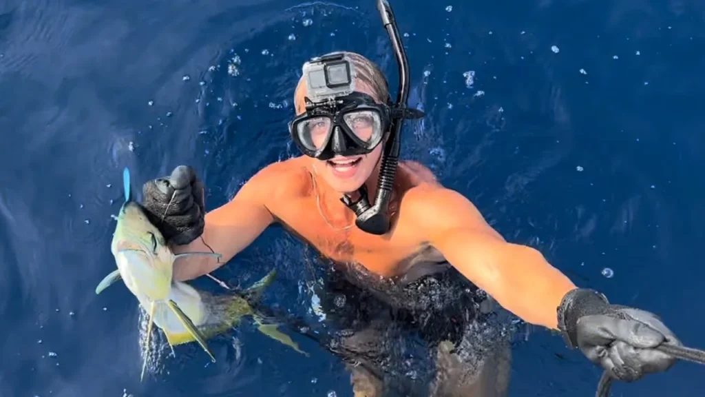Sailing Zola crew member snorkeling in clear blue water