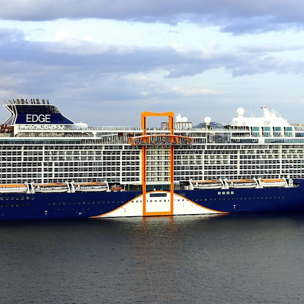 A Celebrity Edge-class cruise ship with its glass-fronted Infinite Veranda cabins