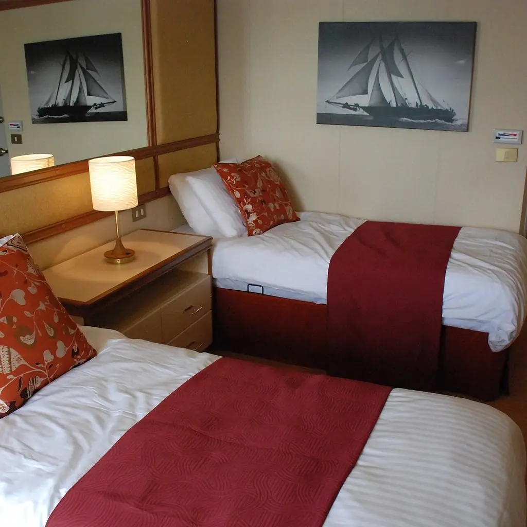 A standard twin-bed cabin on a cruise ship