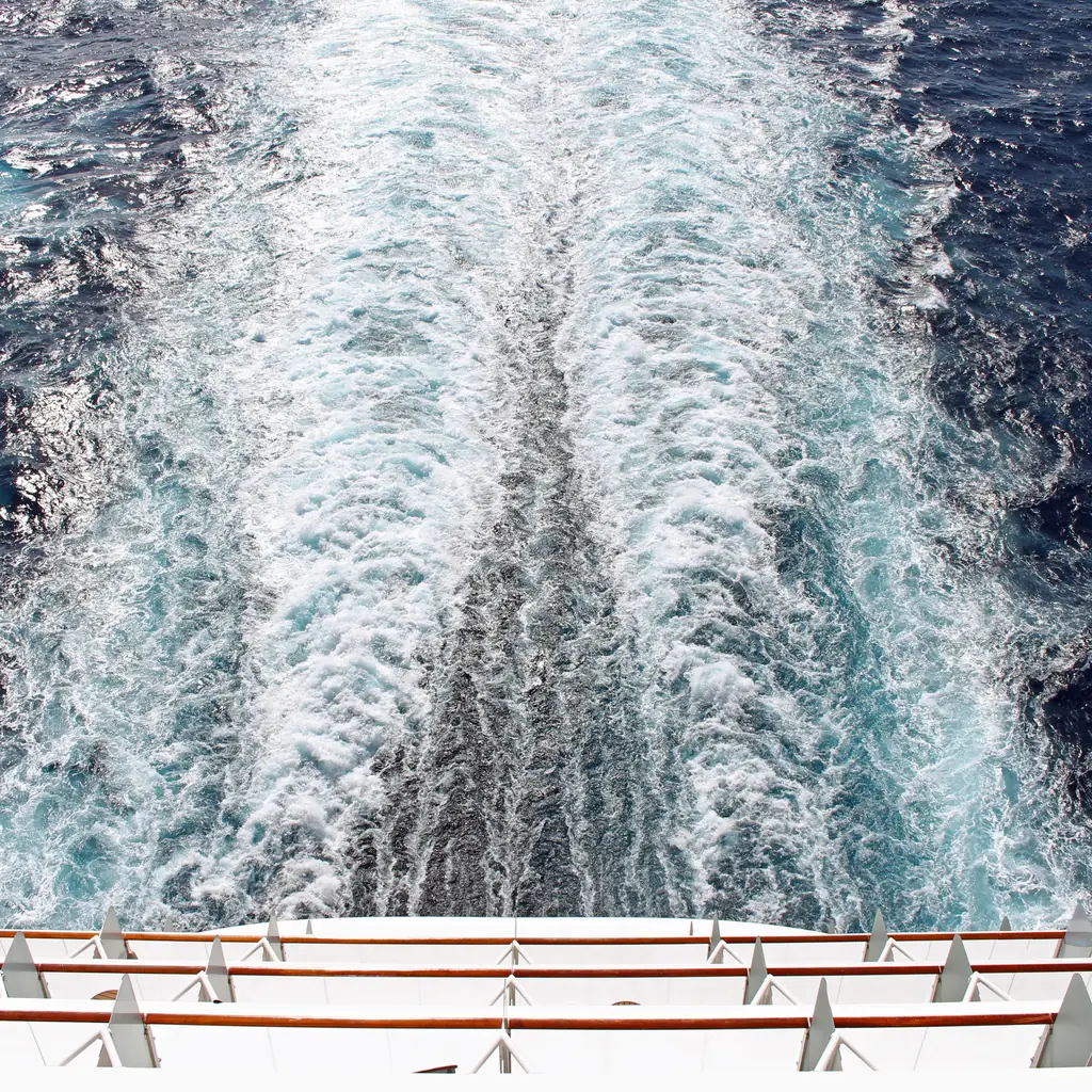The ship's wake seen from a deep aft-facing cruise balcony