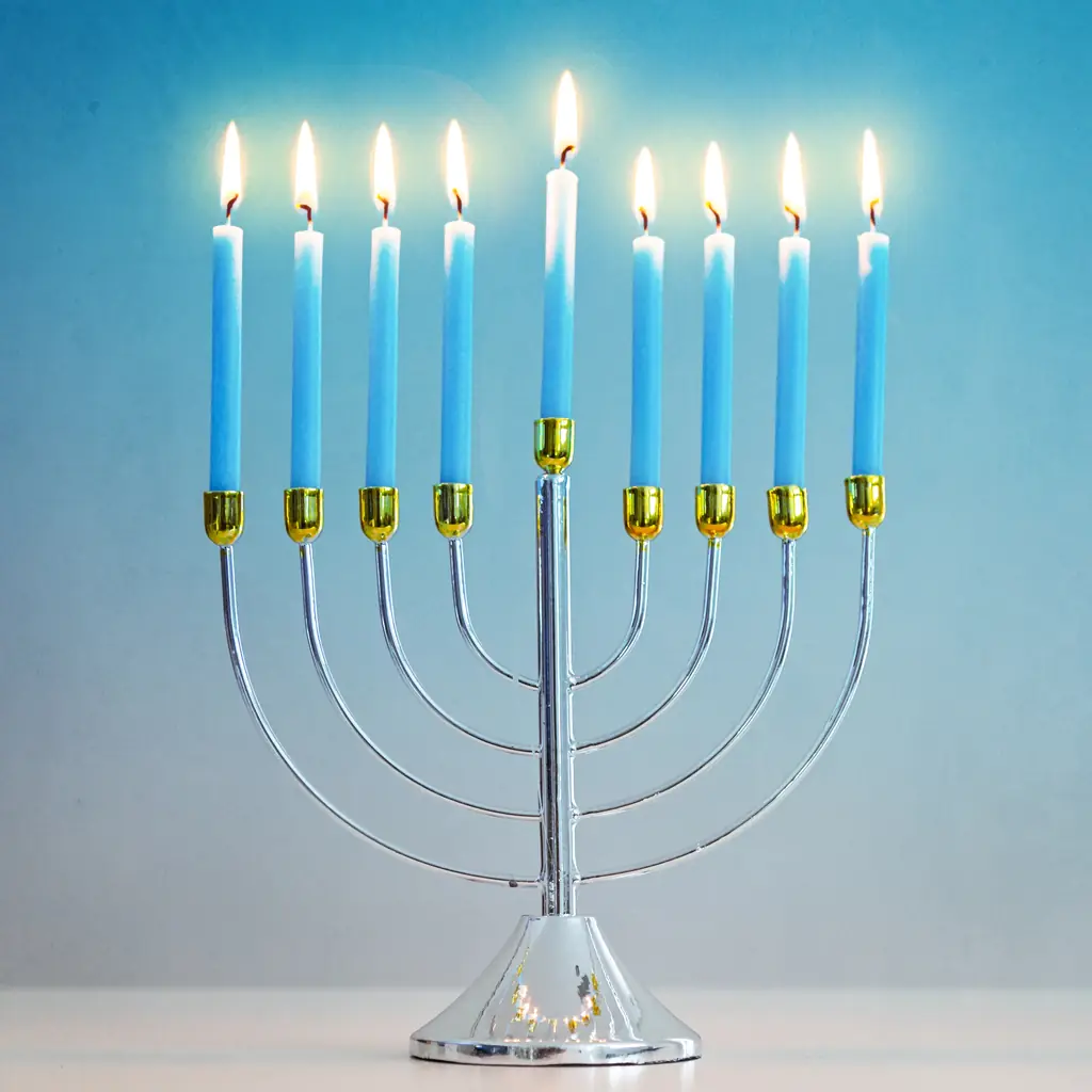 A Hanukkah menorah with lit candles in the evening