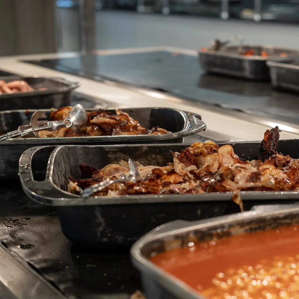 Fully stocked buffet trays at the start of service