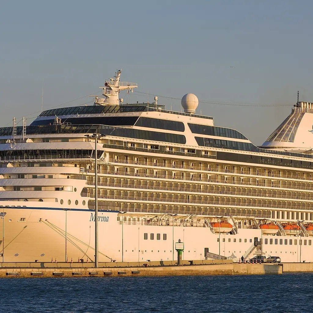 A cruise ship docked at golden hour in Sète, France