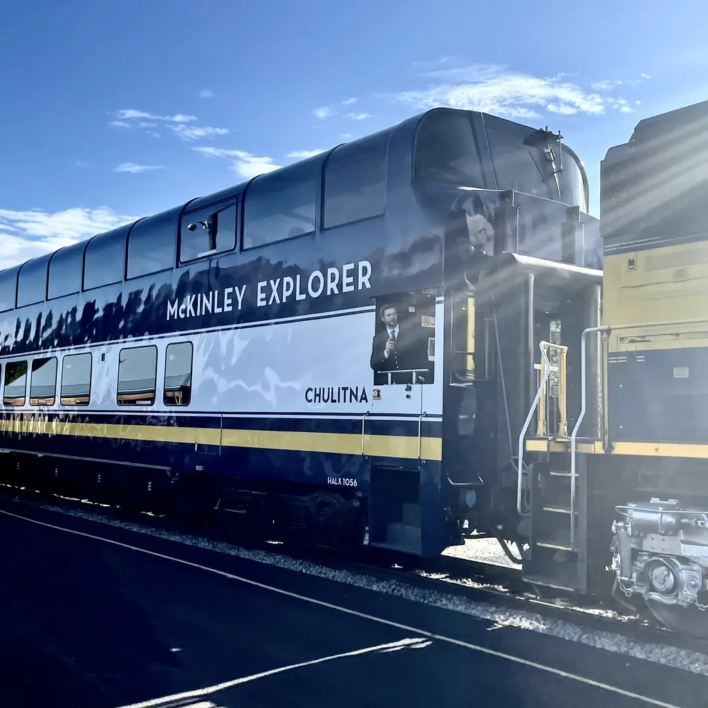 An Alaska Railroad Ultra Dome Car, the glass-domed railcar used on cruisetour rail routes, parked at the Denali National Park depot.