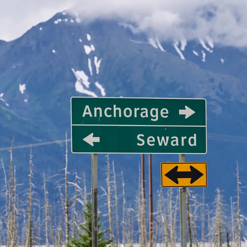 A road sign for Anchorage and Seward along the Seward Highway in Alaska, the route used for private transfers between the two cities.
